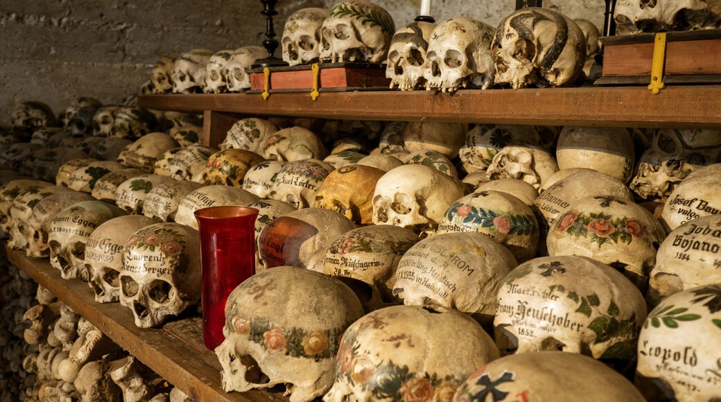 View of hundreds of painted skulls and bones inside the famous charnel house at the mountain village Hallstatt in the Salzkammergut region, Austria