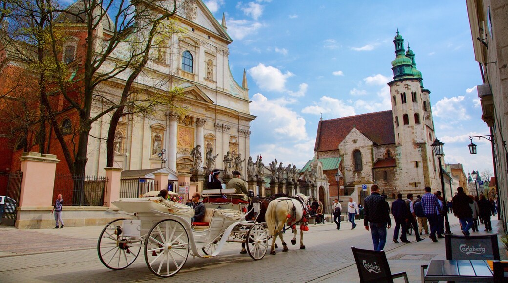 Krakow showing a church or cathedral and street scenes