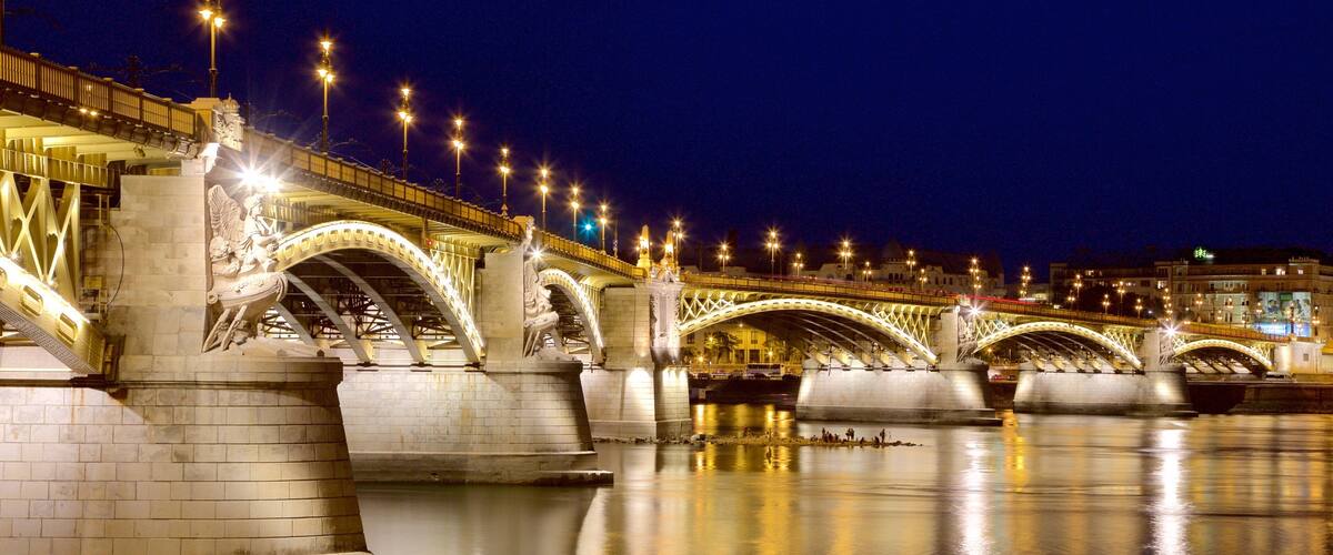 Budapest showing night scenes, a bridge and a river or creek