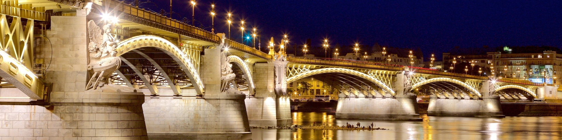 Budapest showing night scenes, a bridge and a river or creek