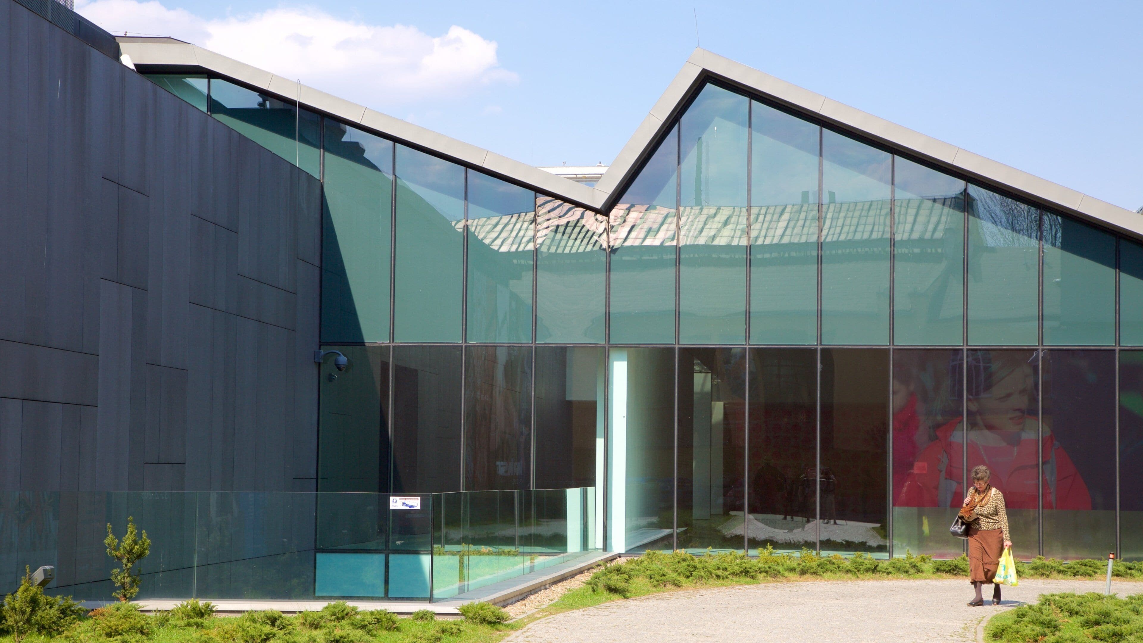 Krakow showing modern architecture as well as an individual female