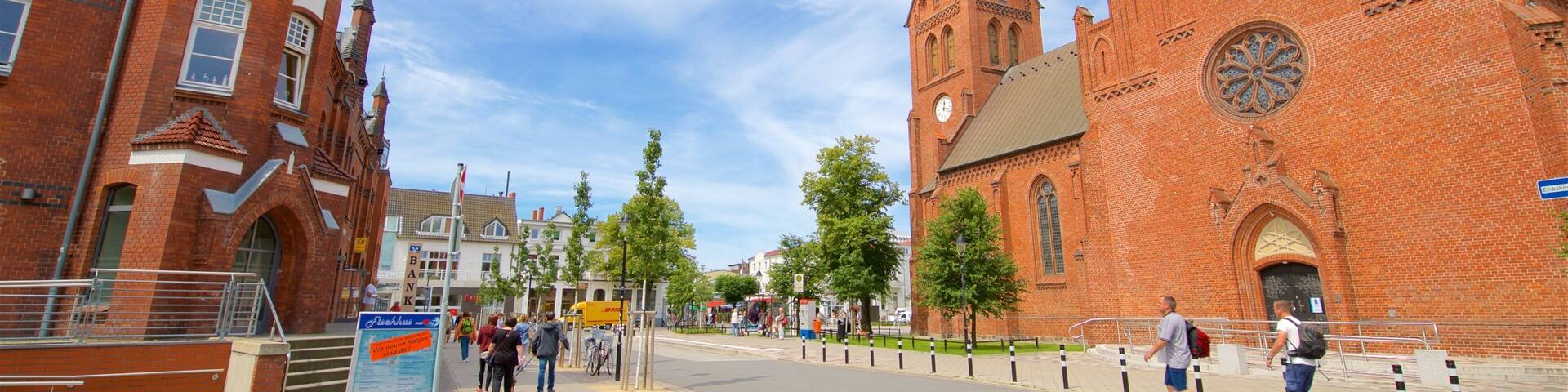 A historic church with a tall spire and a clock tower.