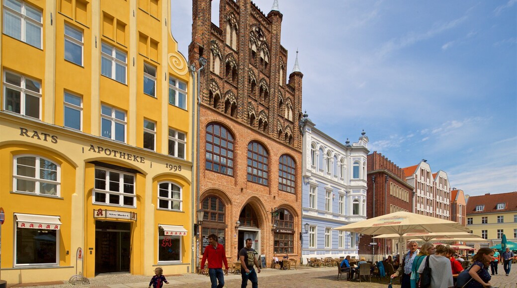 Wulflam House featuring heritage elements and street scenes as well as a small group of people