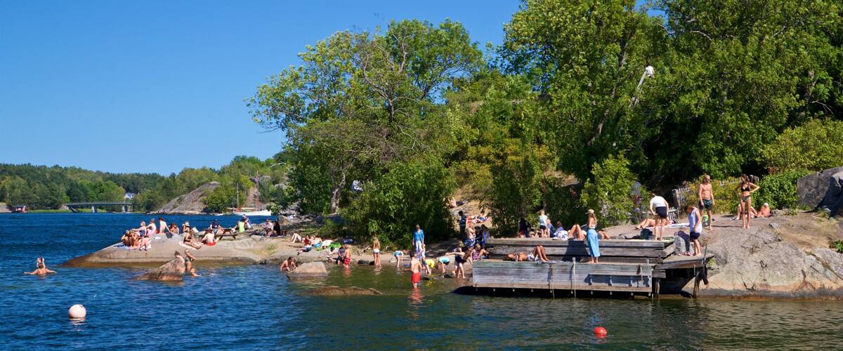 Battery Park showing a lake or waterhole as well as a small group of people