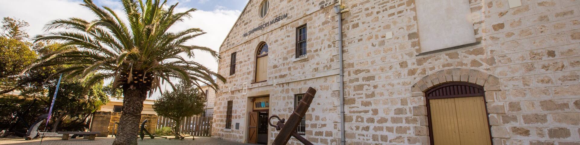 The Shipwreck Galleries showing heritage elements and a sunset