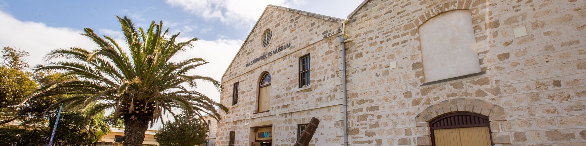 The Shipwreck Galleries showing heritage elements and a sunset