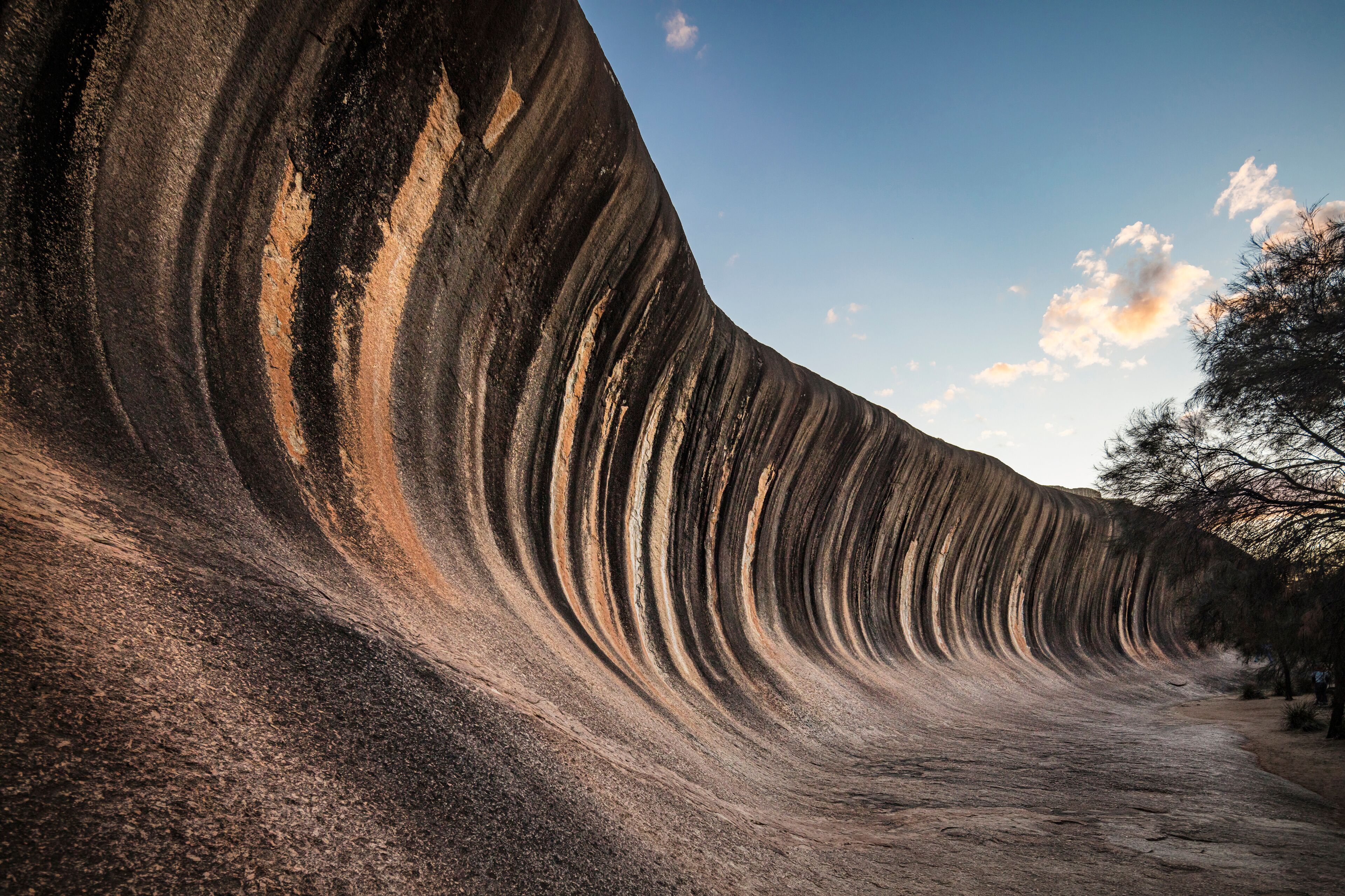 Wave Rock, a 15 metre high natural rock formation that is shaped like a tall breaking ocean wave and is located at Hyden in Western Australia