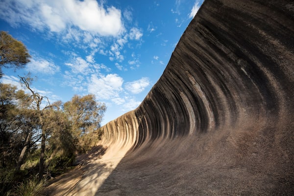 Wave Rock, a 15 metre high natural rock formation that is shaped like a tall breaking ocean wave and is located at Hyden in Western Australia