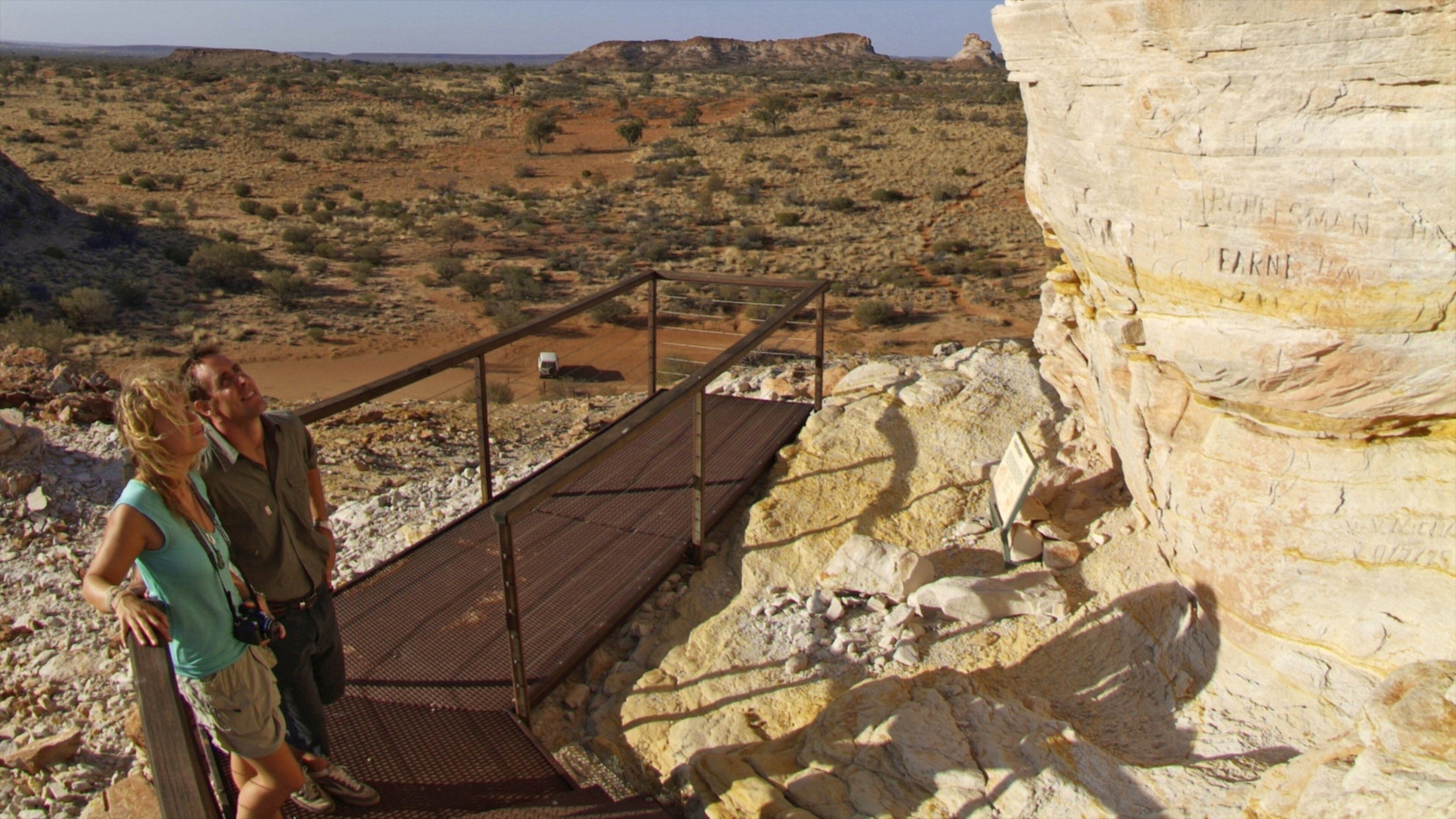 Chambers Pillar which includes desert views and a gorge or canyon as well as a couple
