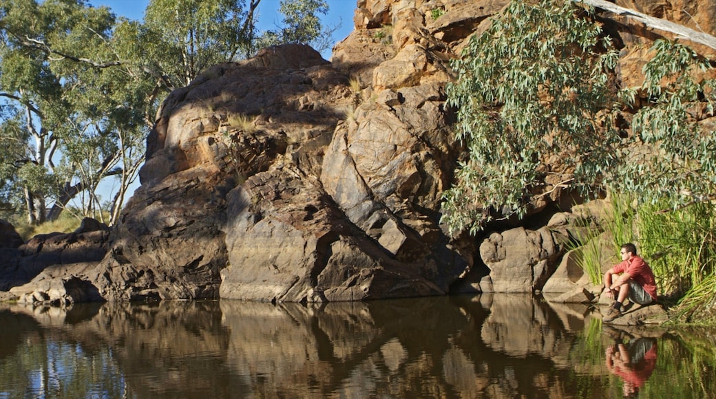 Alice Springs featuring a lake or waterhole as well as an individual male