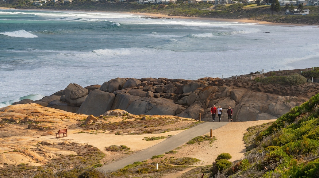 Boomer Beach which includes general coastal views and rocky coastline as well as a small group of people