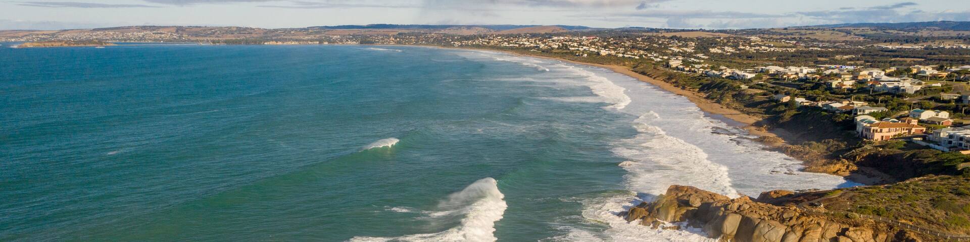 Boomer Beach featuring a coastal town, general coastal views and rugged coastline