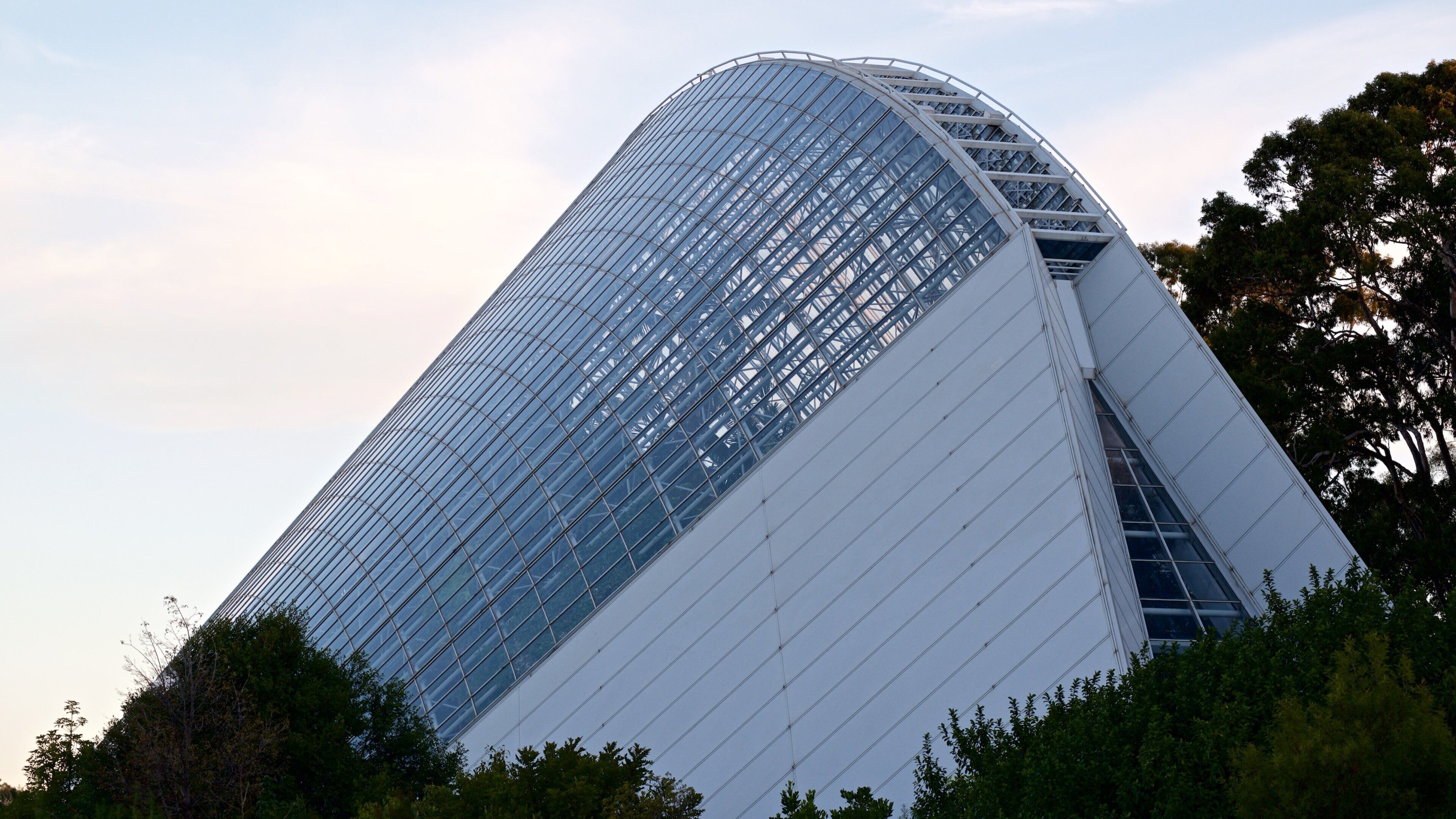 Bicentennial Conservatory showing modern architecture and a sunset