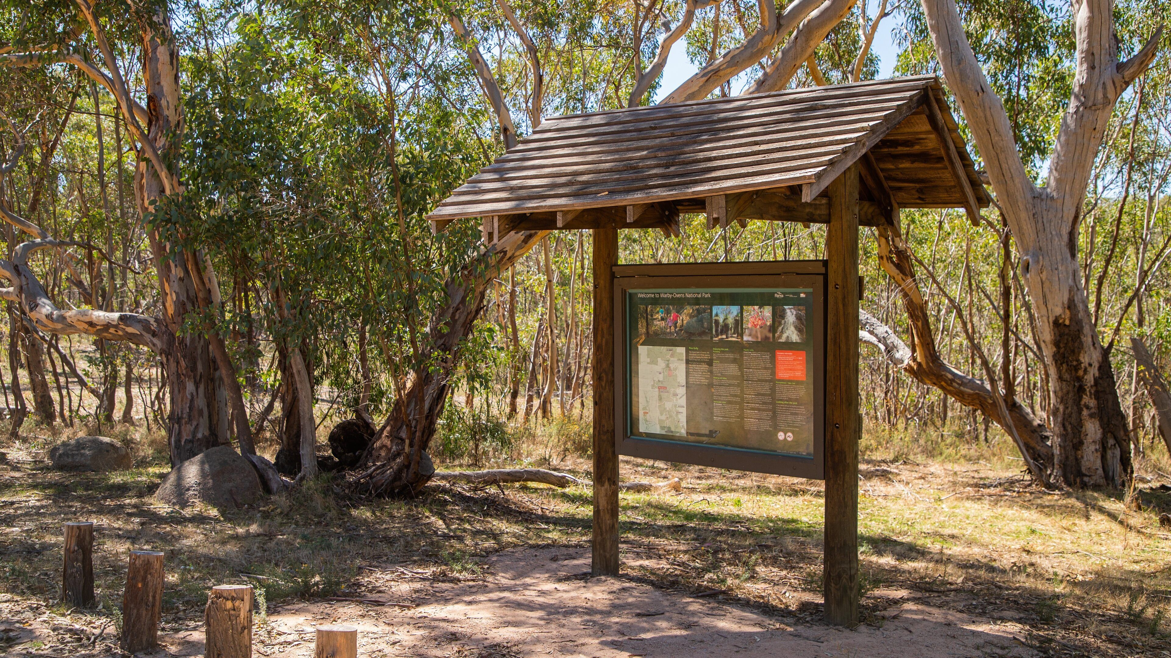 Warby Ovens National Park which includes tranquil scenes and signage
