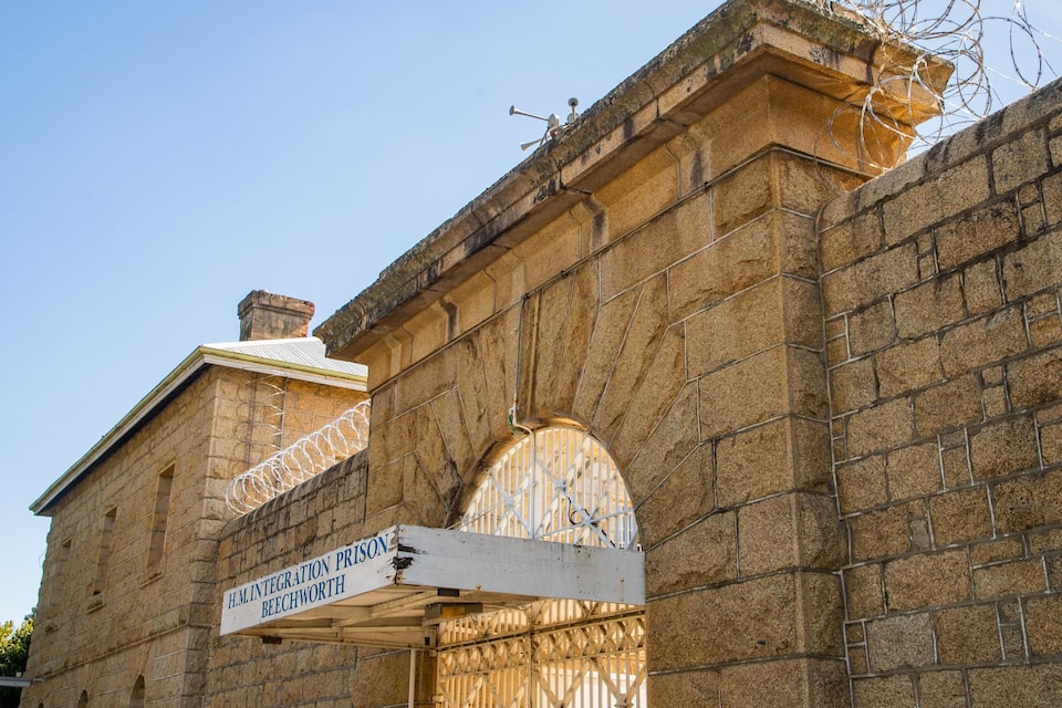A stone building with a sign reading "H.M. Integration Prison Beechworth."