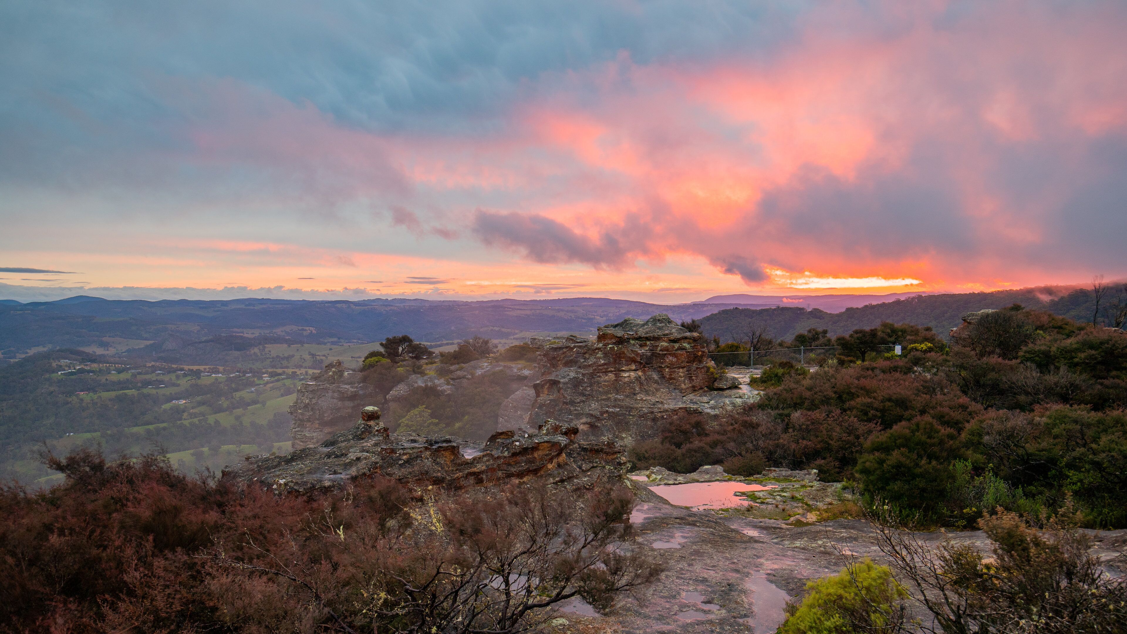 Hassans Wall Lookout which includes a sunset, landscape views and a gorge or canyon