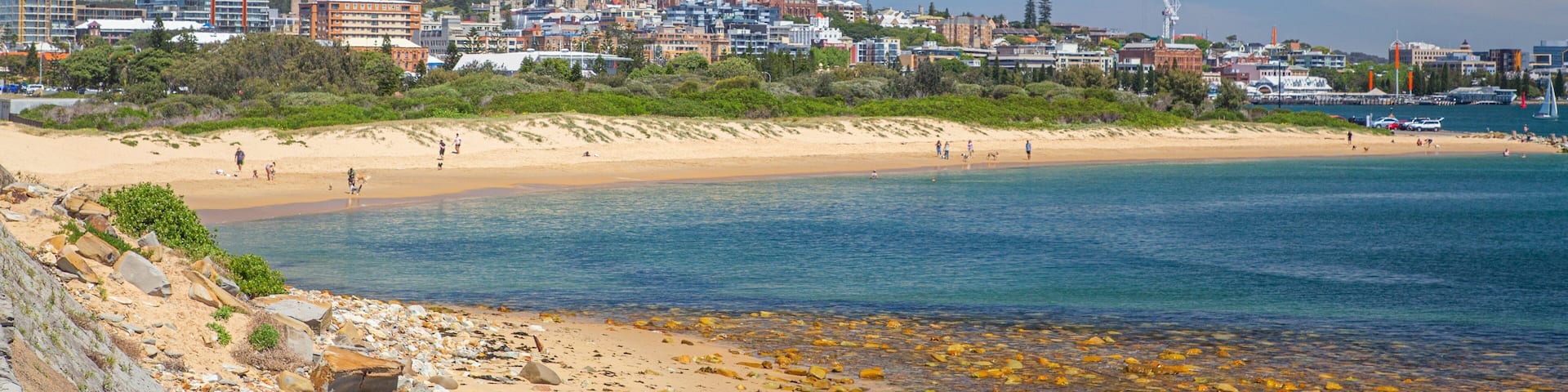 Horseshoe Beach which includes a coastal town, general coastal views and a beach