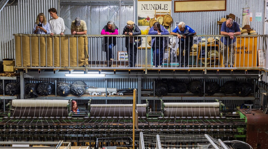 Nundle Woollen Mill which includes industrial elements as well as a small group of people
