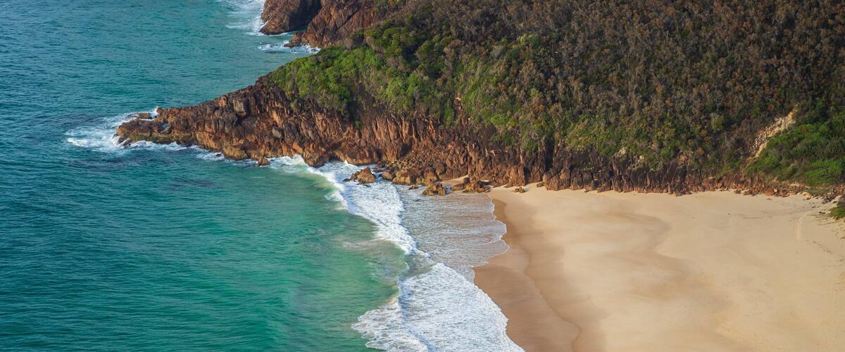 Tomaree Head showing general coastal views, a beach and rugged coastline