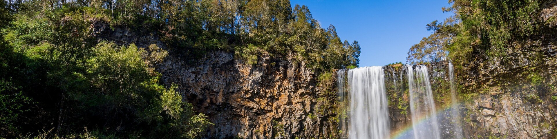 Dangar Falls featuring a lake or waterhole and a cascade