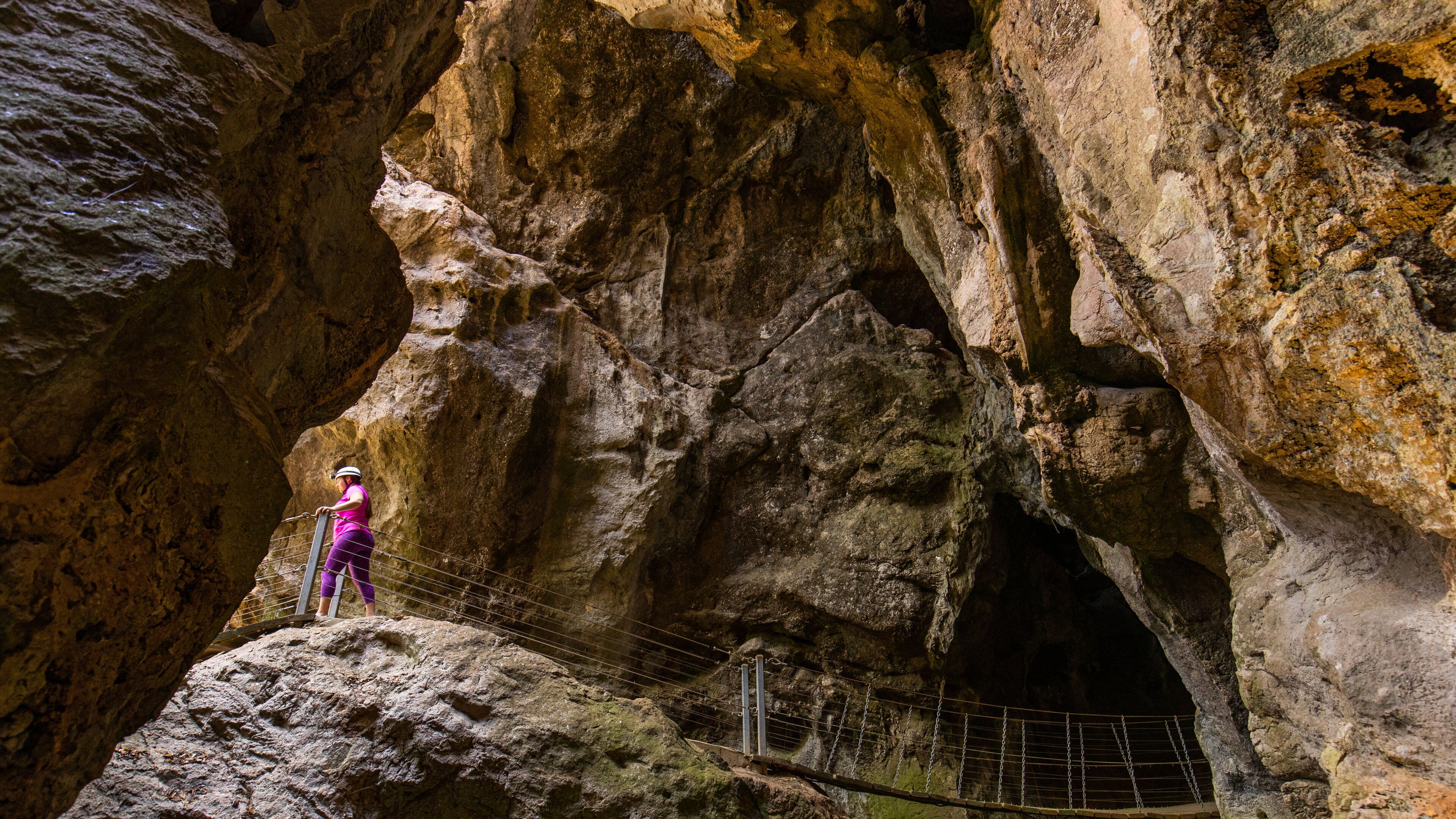 Capricorn Caves showing caving and caves as well as an individual femail