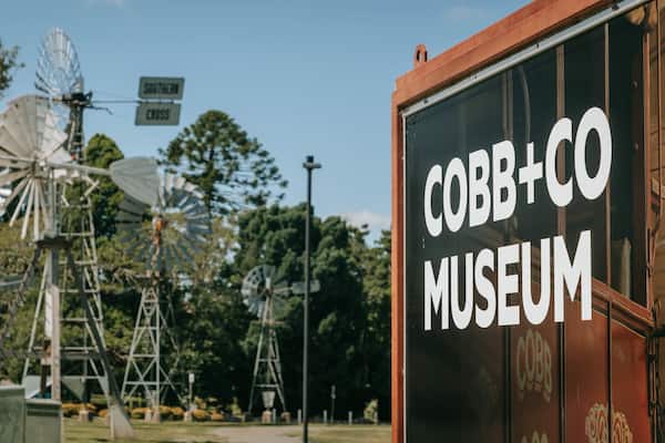 The Cobb+Co Museum with windmills in the background.