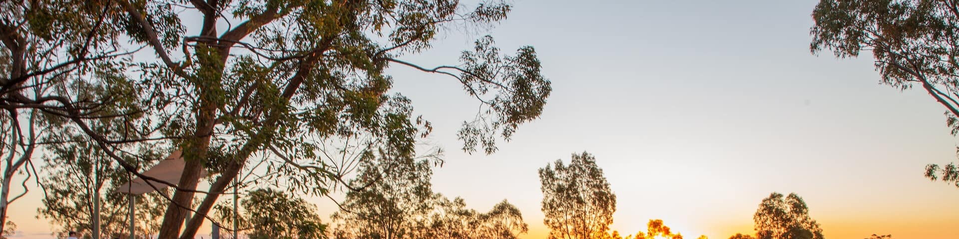 Mount Gravatt Lookout showing a sunset and tranquil scenes as well as a couple