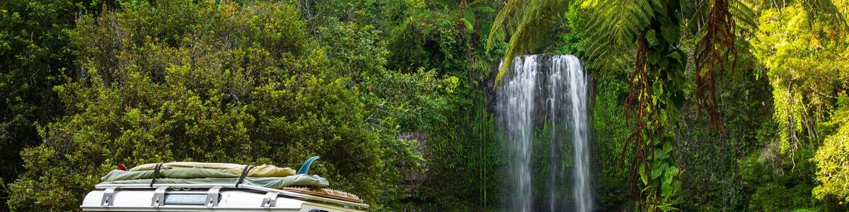 Millaa Millaa Falls which includes a cascade and off road driving