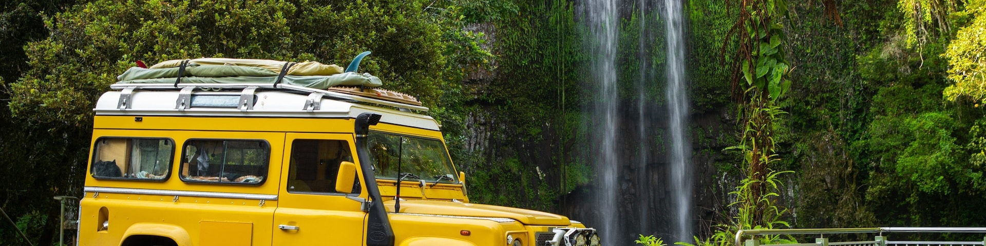 Millaa Millaa Falls which includes a cascade and off road driving