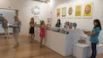 An indoor exhibition at the Cairns Museum with various displays and informational posters.