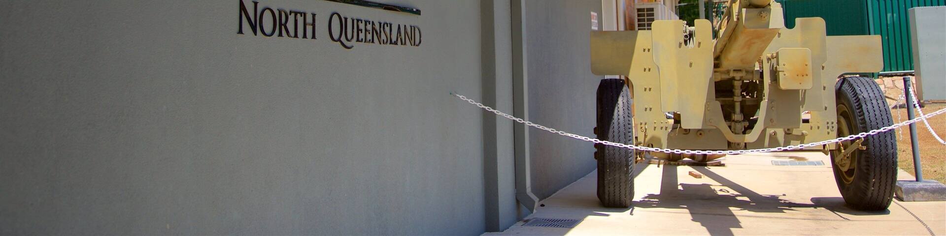 The exterior of the Army Museum in North Queensland, featuring a mounted cannon and a sign with the museum's name.