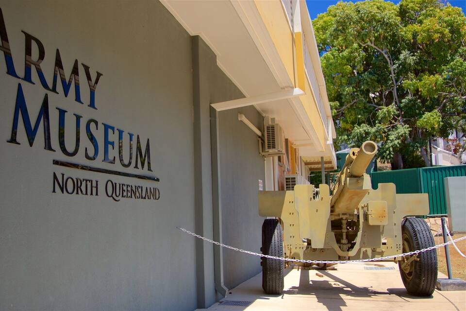 The exterior of the Army Museum in North Queensland, featuring a mounted cannon and a sign with the museum's name.