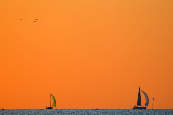 Noumea which includes sailing, a sunset and general coastal views