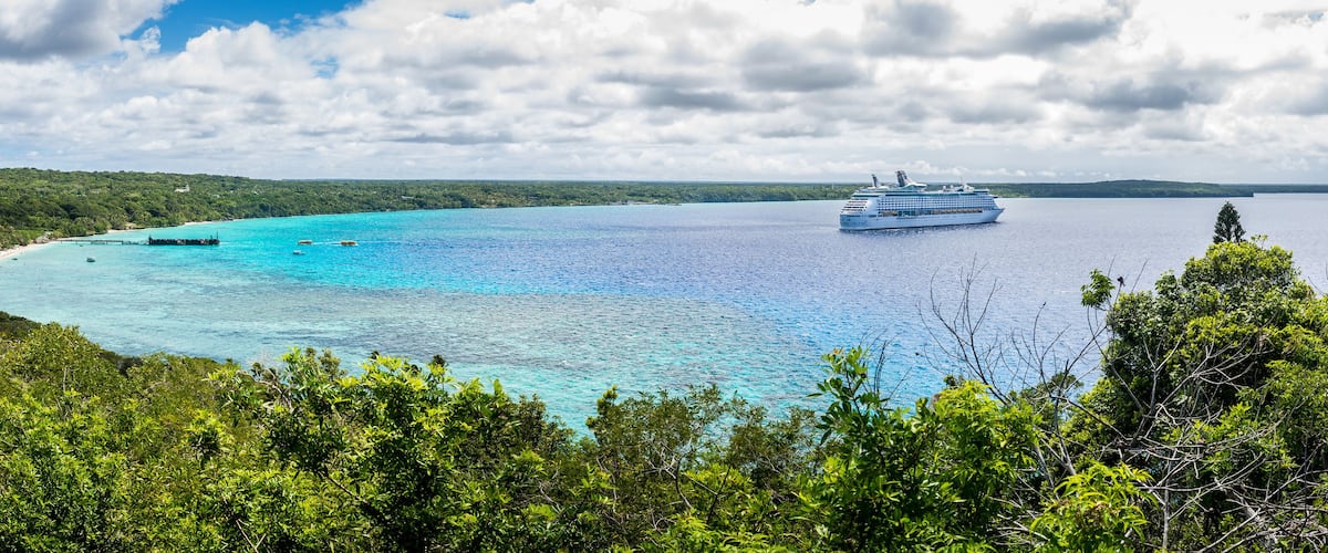 LIfou, New Caledonia, view of Jinek Bay and anchored Voyager of the Seas from Notre Dame de Lourde church,