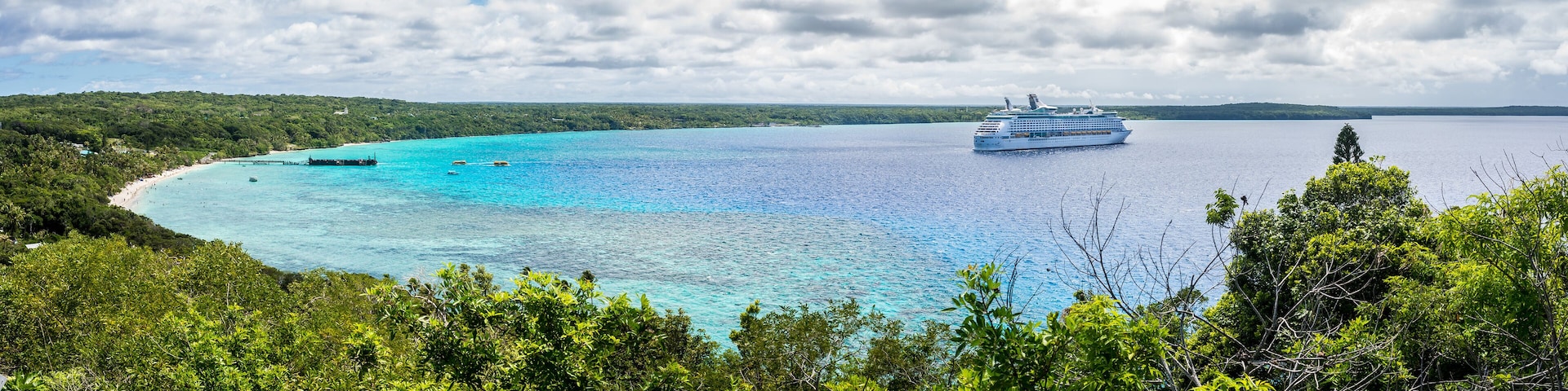 LIfou, New Caledonia, view of Jinek Bay and anchored Voyager of the Seas from Notre Dame de Lourde church,