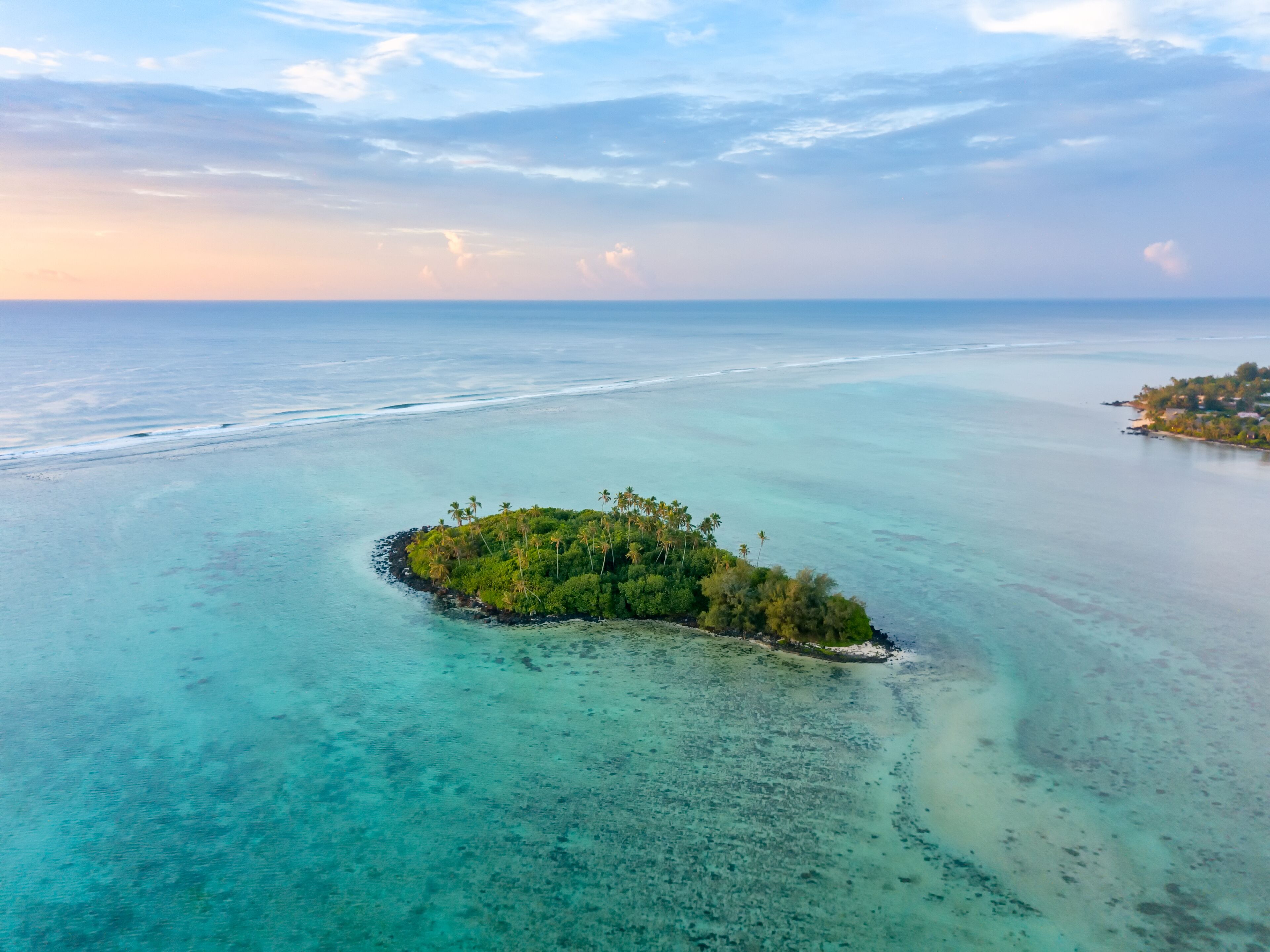 An aerial view of Muri Lagoon at sunrise on Rarotonga in the Cook Islands, Shutterstock ID 1277347960, Purchase Order: -