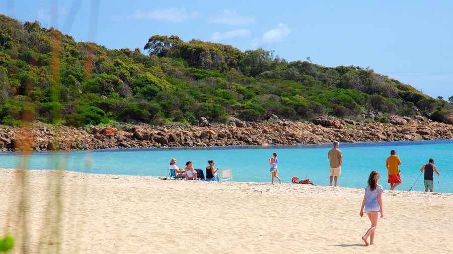 Naturaliste which includes a sandy beach and rocky coastline as well as a small group of people