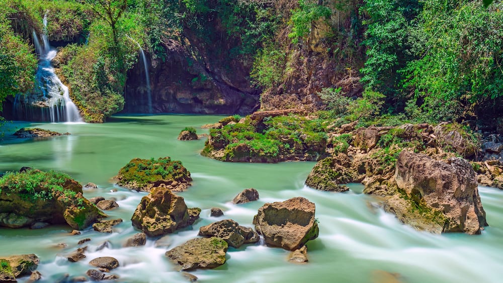 Long exposure panorama of the limestone ridge with cascades and waterfalls of Semuc Champey in the Peten jungle and rainforest of Guatemala.