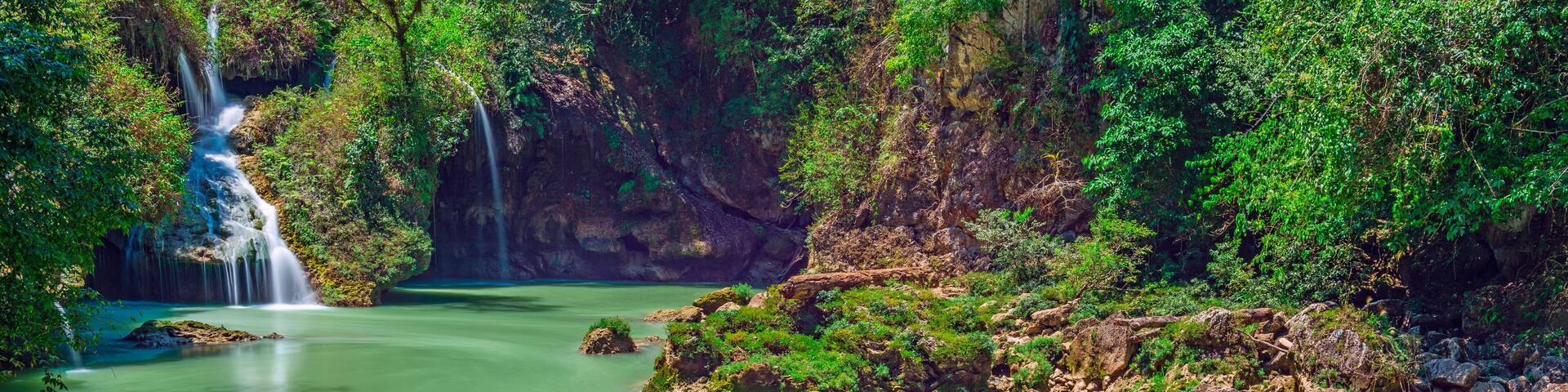 Long exposure panorama of the limestone ridge with cascades and waterfalls of Semuc Champey in the Peten jungle and rainforest of Guatemala.