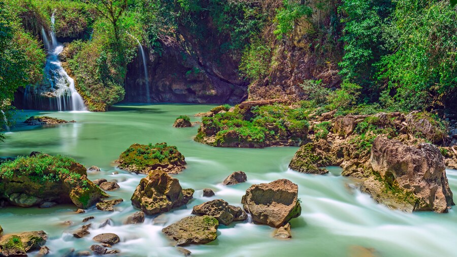 Long exposure panorama of the limestone ridge with cascades and waterfalls of Semuc Champey in the Peten jungle and rainforest of Guatemala.