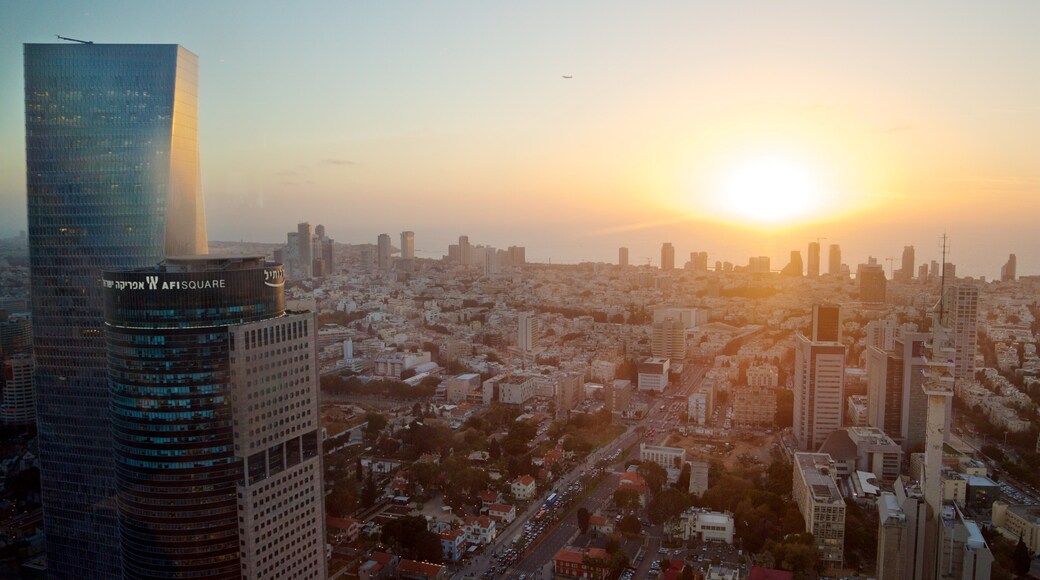 Azrieli Observatory showing a skyscraper, a sunset and landscape views