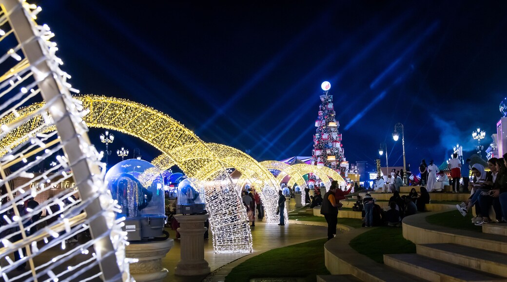 Global village with big Christmas tree and winter holidays decorations in Dubai