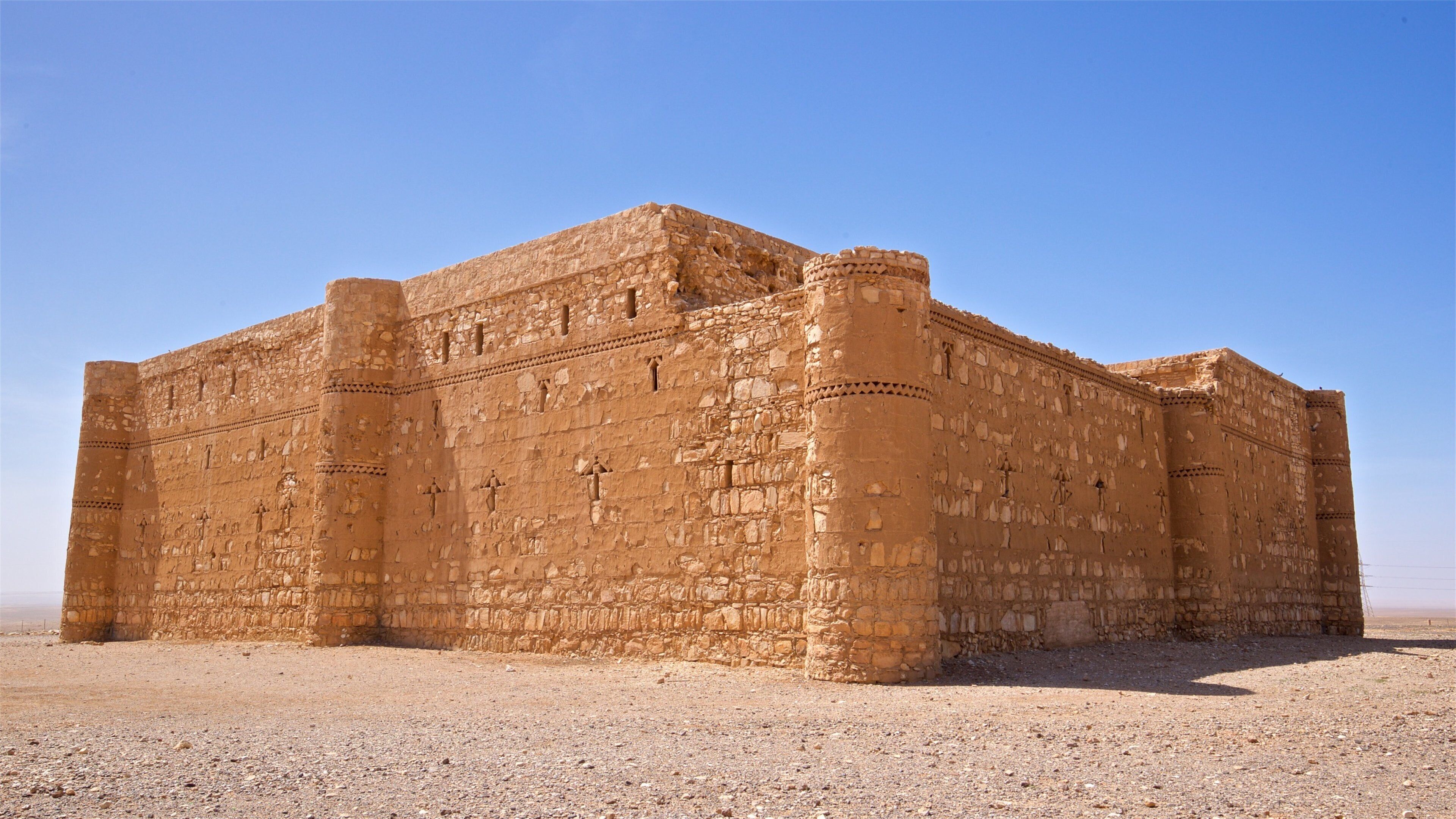 Qasr Kharana which includes desert views and heritage architecture