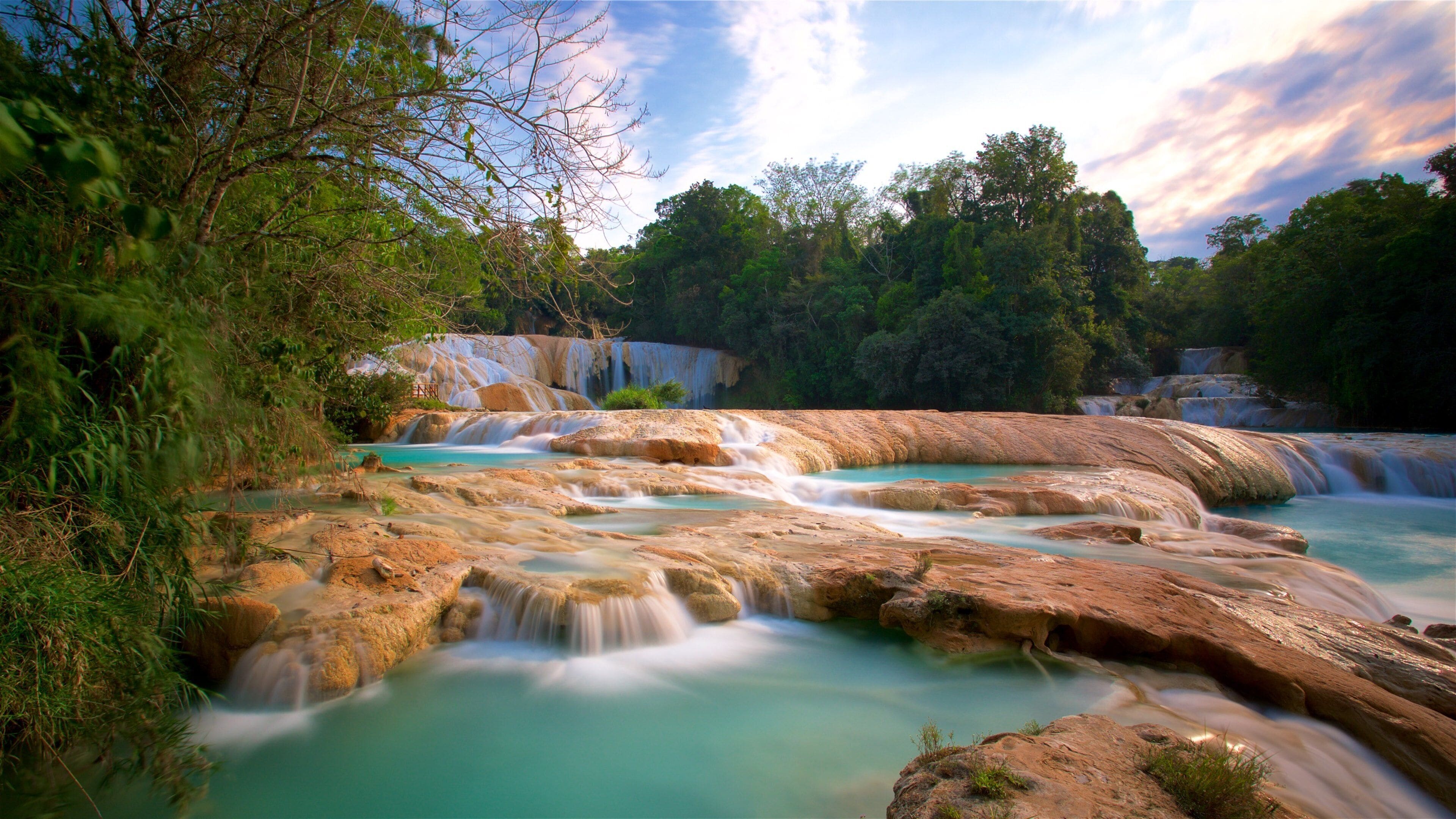 Cascadas de Agua Azul showing a river or creek, landscape views and a sunset