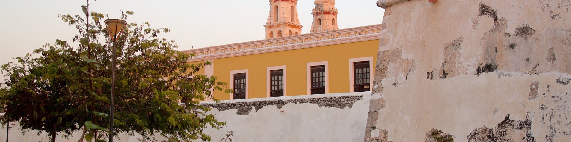 Old City Wall featuring heritage elements and a sunset