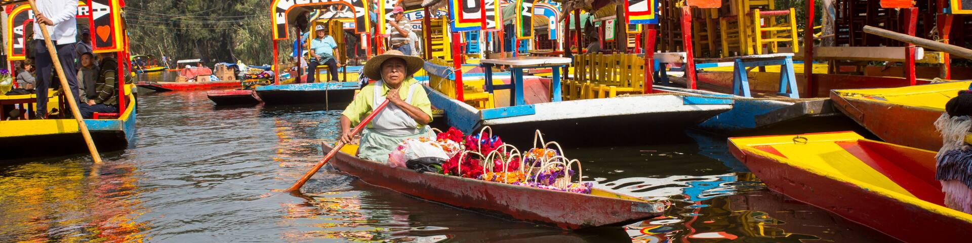 Mexican workers painting colorful trajineras boats in xochimilco, Mexico City, Mexico. 2016-12-19