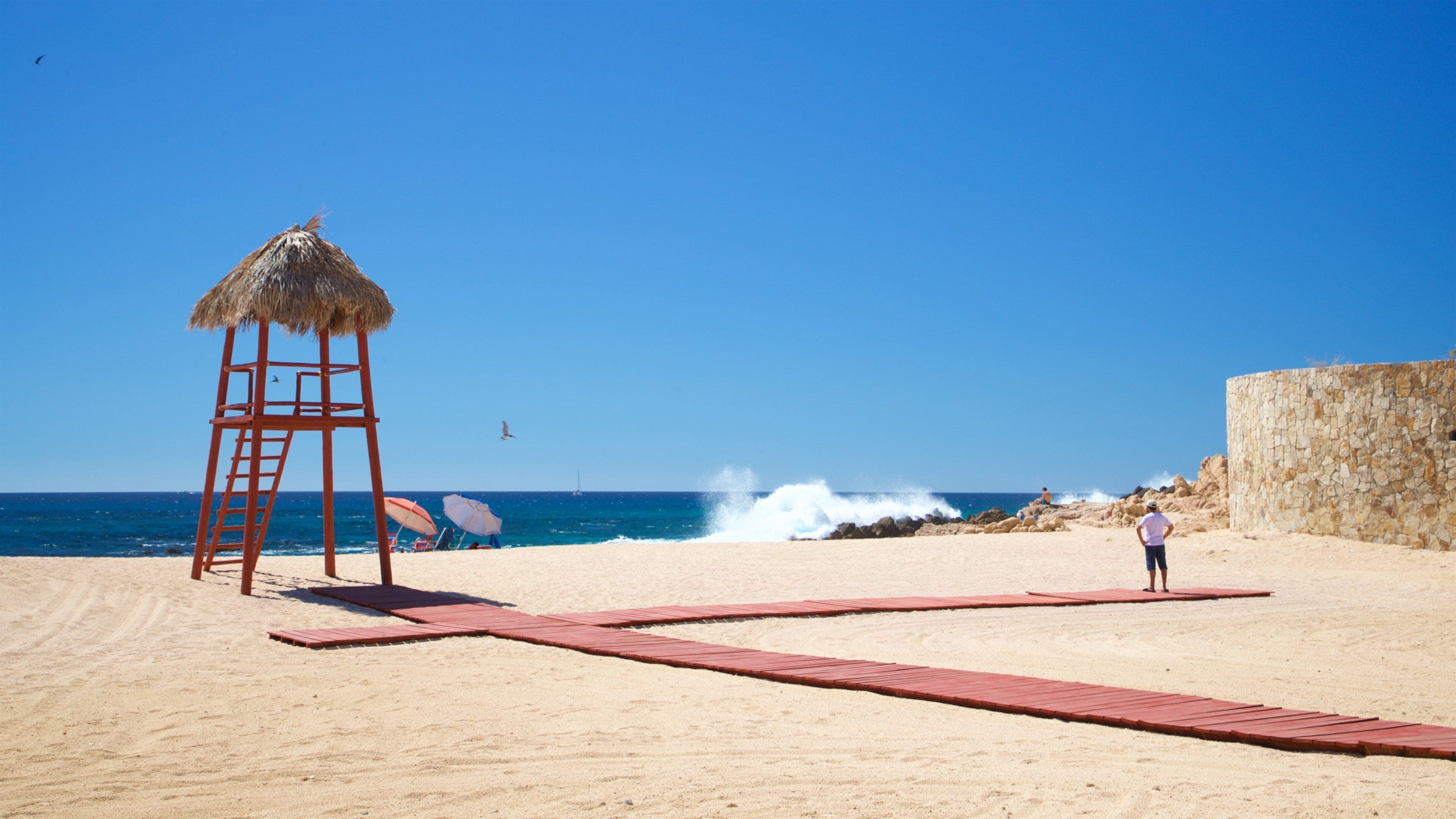 Playa Las Viudas which includes a sandy beach and general coastal views as well as an individual male