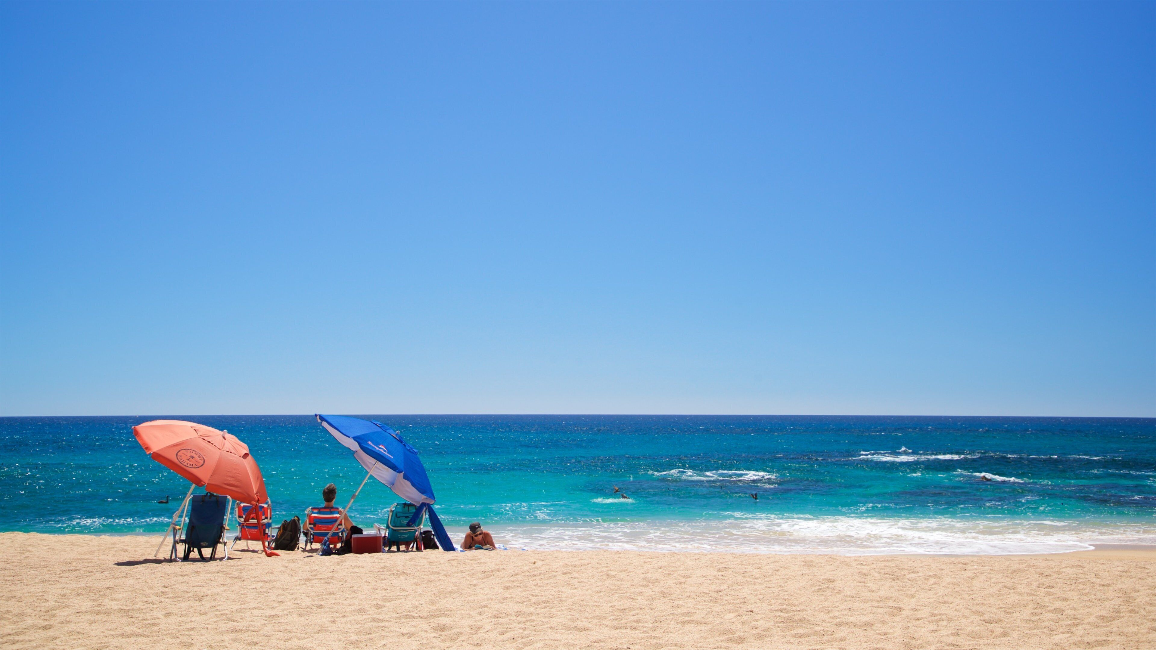 Playa Las Viudas showing a sandy beach and general coastal views as well as a small group of people