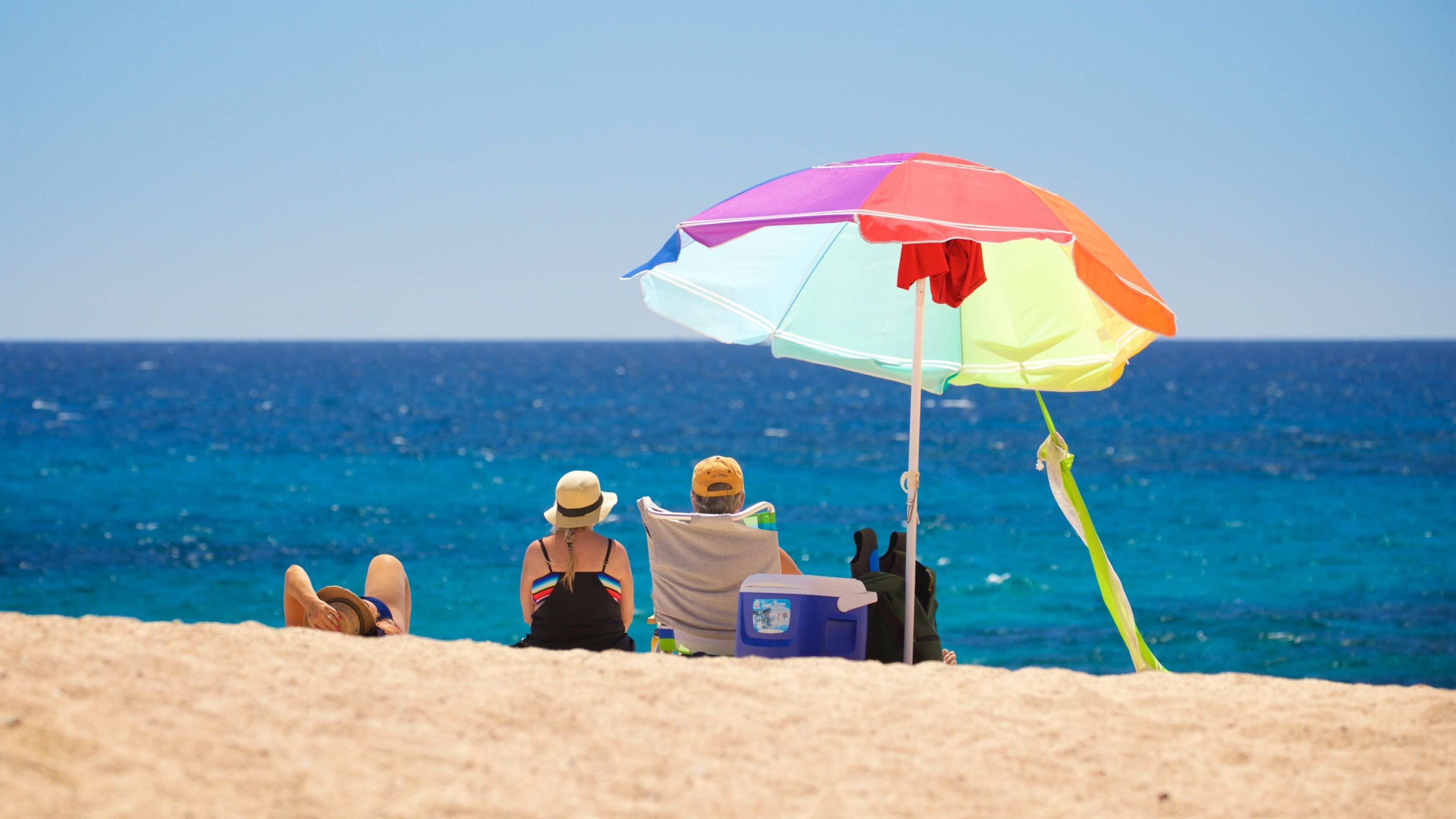 Playa Las Viudas showing a sandy beach and general coastal views as well as a small group of people