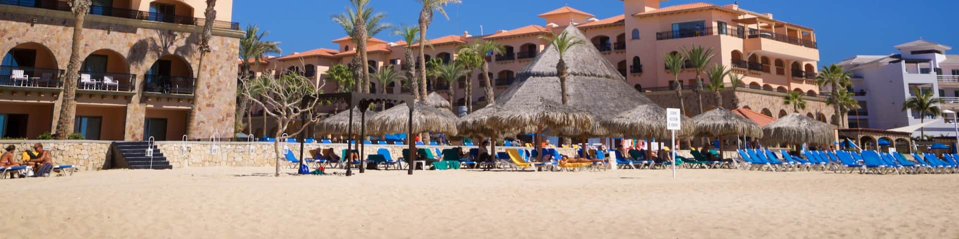 Playa Hotelera showing tropical scenes, a coastal town and a sandy beach